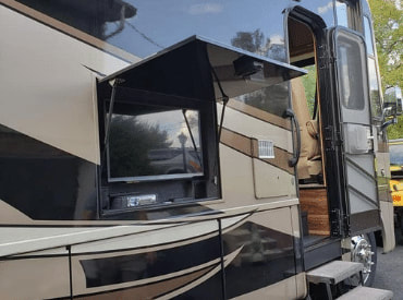 This image shows a luxurious motorhome that has been professionally detailed by a mobile detailing company in San Diego, CA. It features a gleaming exterior and interior with crisp details that showcase the craftsmanship of the service provider. Whether you're traveling on vacation or living in your RV, this motorhome is sure to impress!